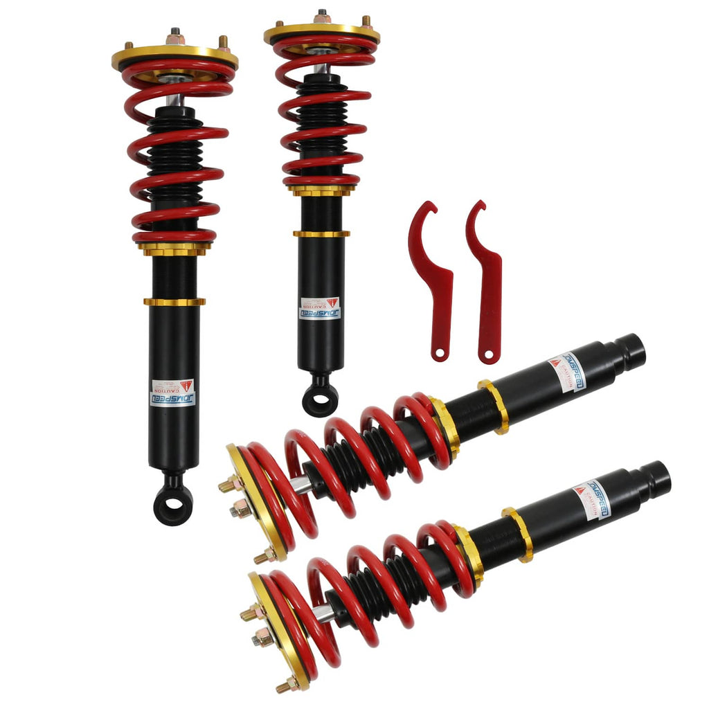 Coilover shock suspension kit with red coil springs, black shocks, and mounting hardware