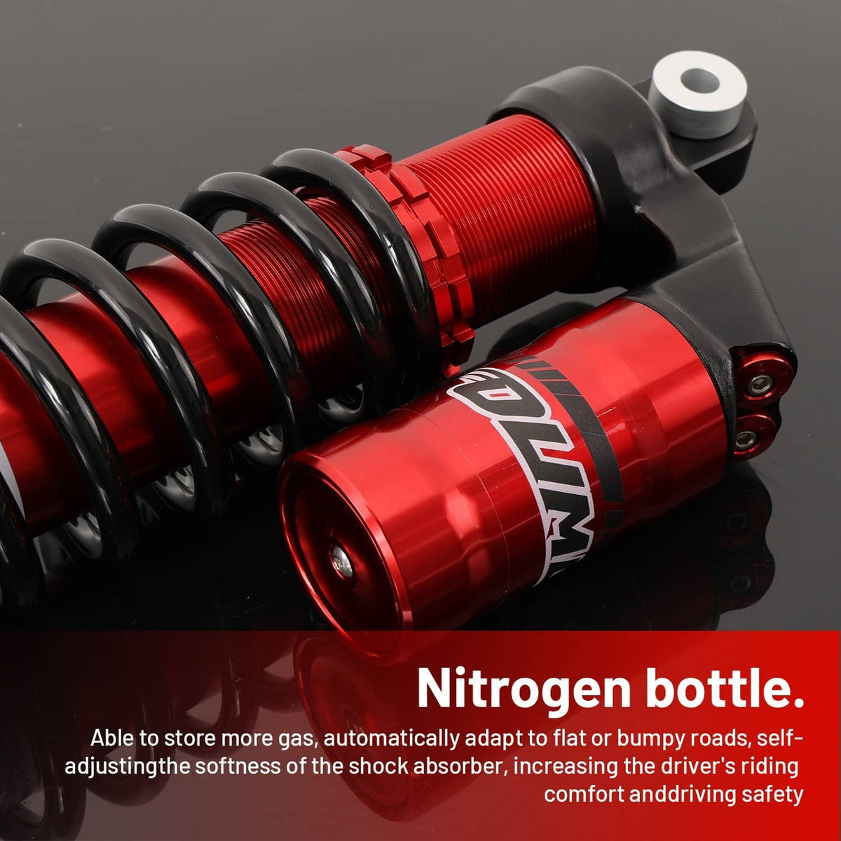 Close-up of red shock absorber canisters with black spring coils and top mounting eyelet