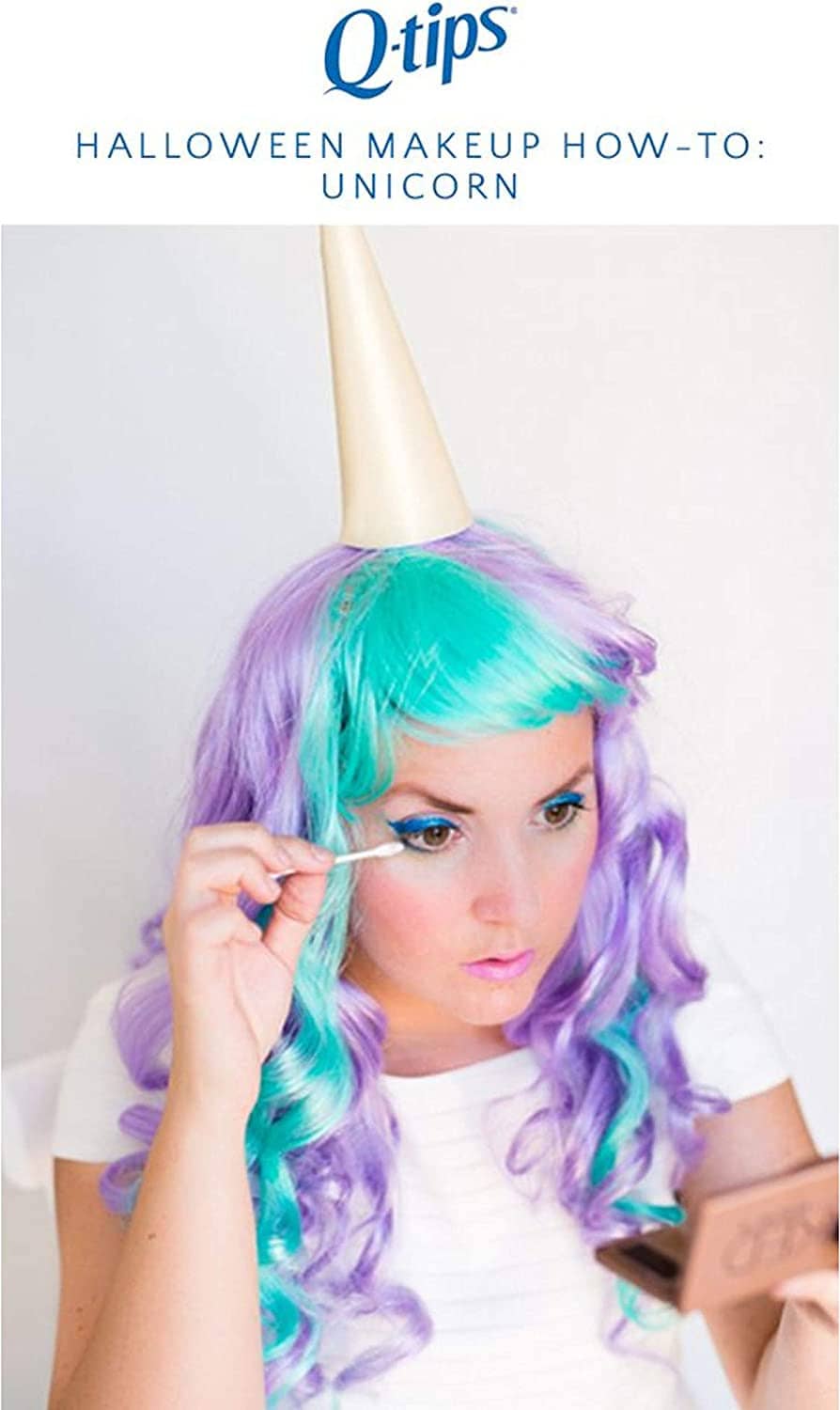 Person applying unicorn makeup with a cotton swab to the face