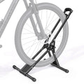 Black foldable freestanding bike storage rack holding a bicycle by the front wheel