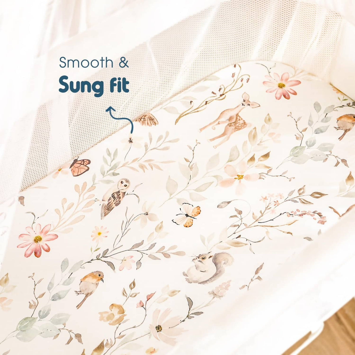 Blush floral woodland fitted bassinet sheet with animal and leaf pattern