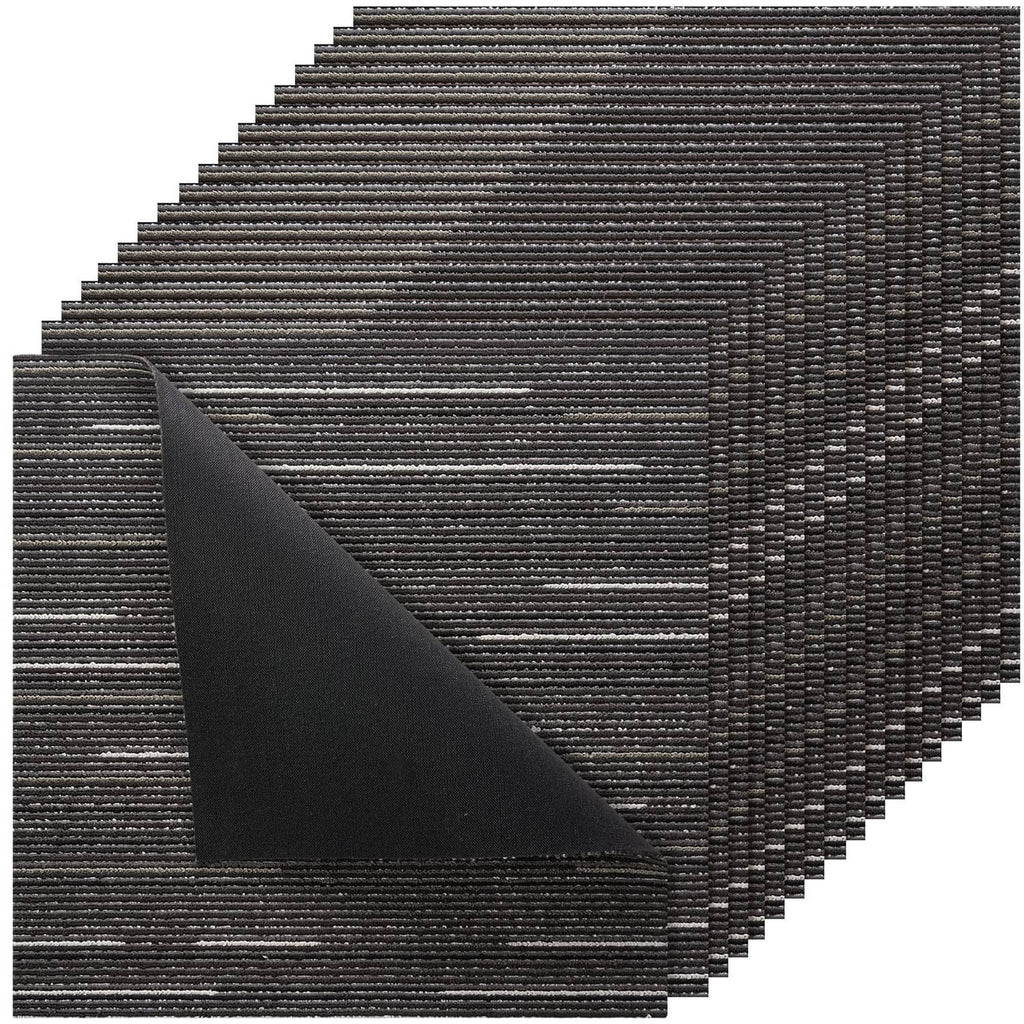 Gray modular carpet tiles, dark woven texture, overlapping stack view