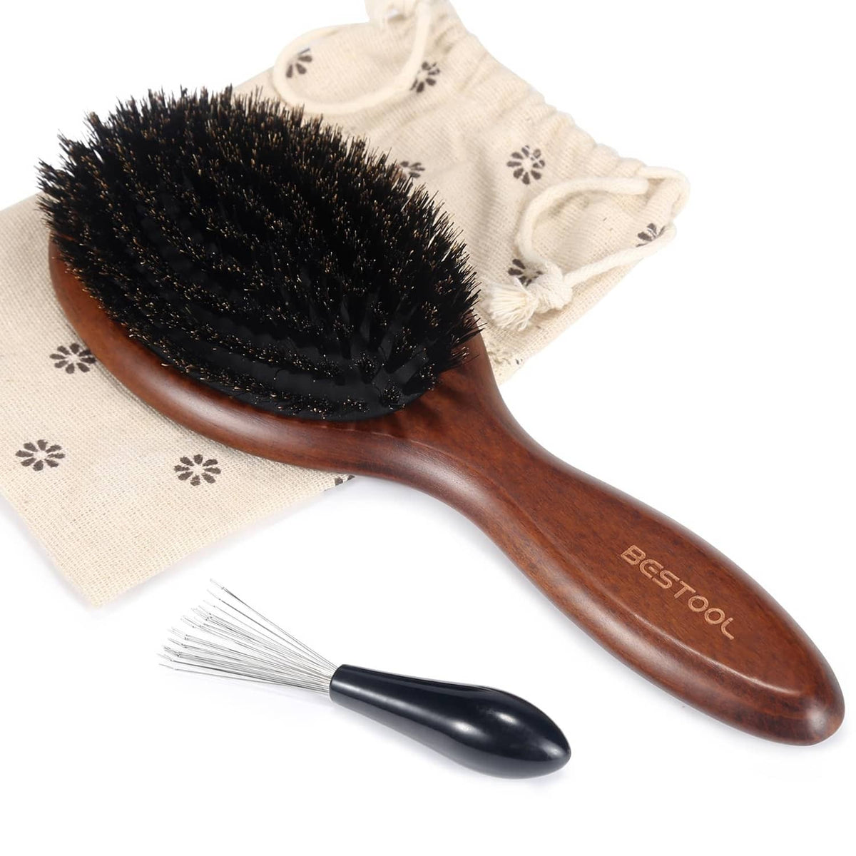 Oval hair brush with dark bristles and brown wooden handle, with drawstring cover bag