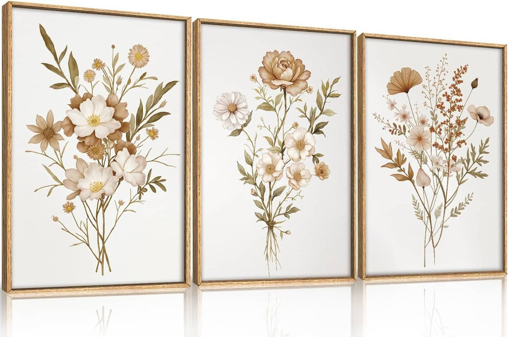 Set of three botanical floral canvas prints with gold frames and neutral tan flowers