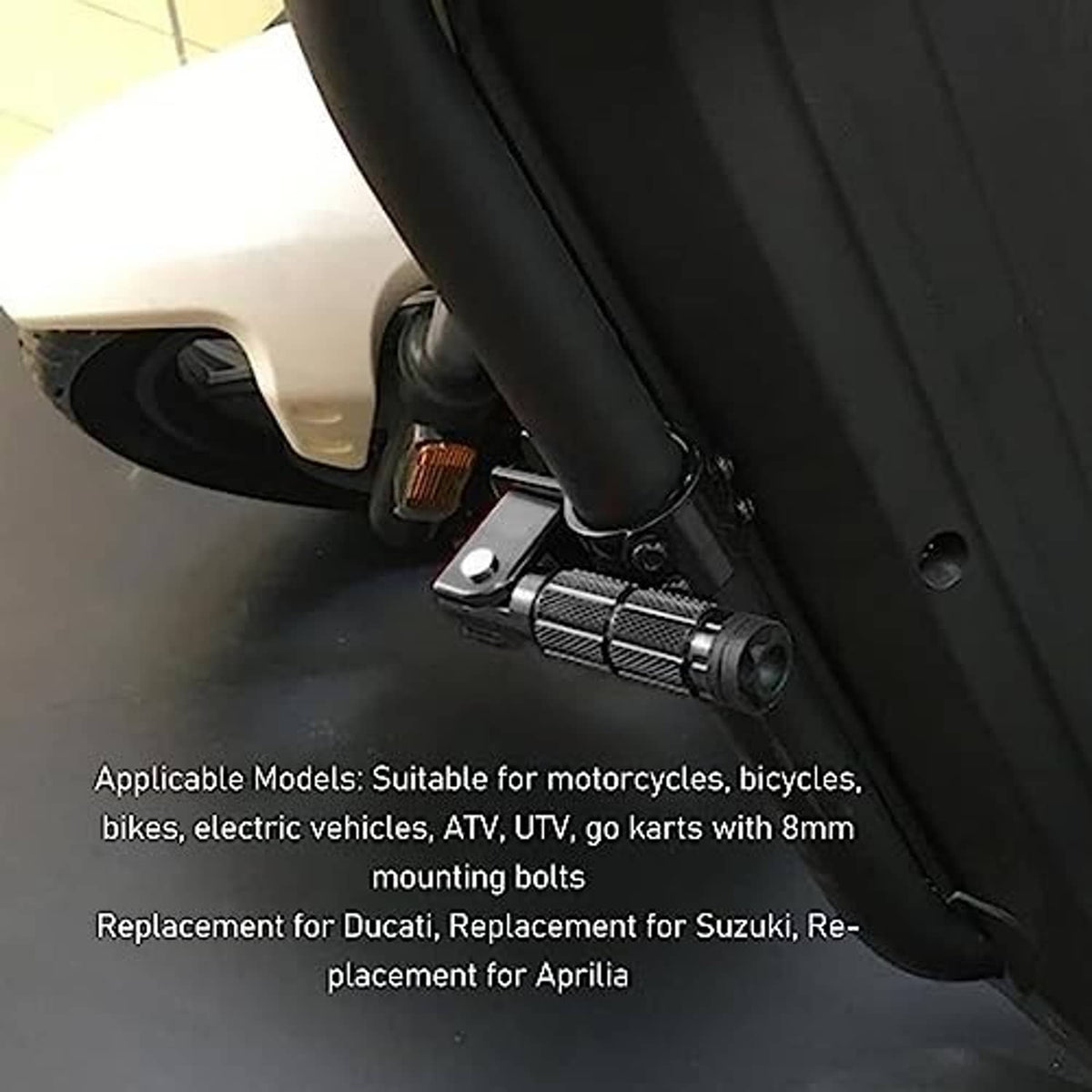 Foldable foot peg installed on a vehicle frame, showing textured grip and bracket
