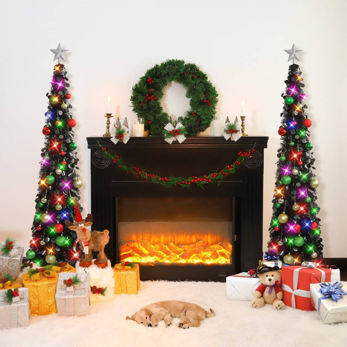 Two 5ft black tinsel Christmas trees with star toppers and multicolor light ornaments