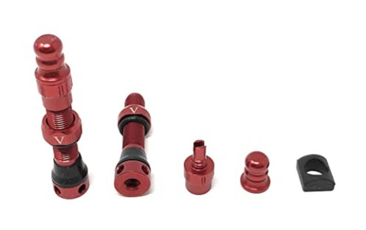Pair of red tubeless Schrader valves with core removal parts and small caps