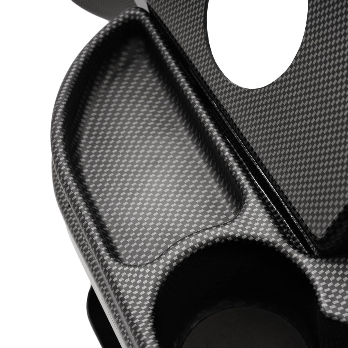 Close-up of carbon fiber dashboard cover showing textured channel and large circular cutout