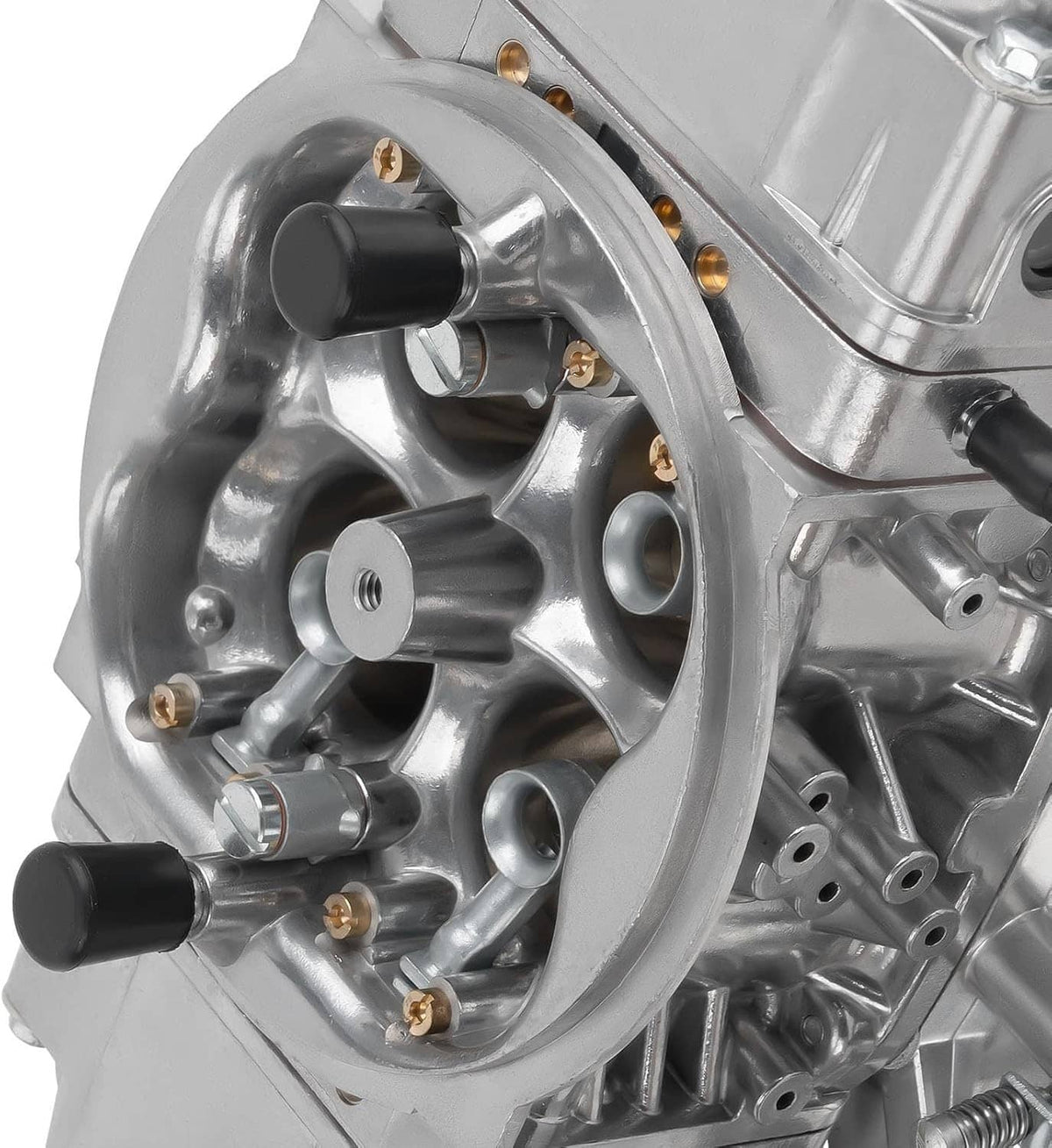 Silver mechanical 4-barrel carburetor with black knobs and gold screws, close-up view.