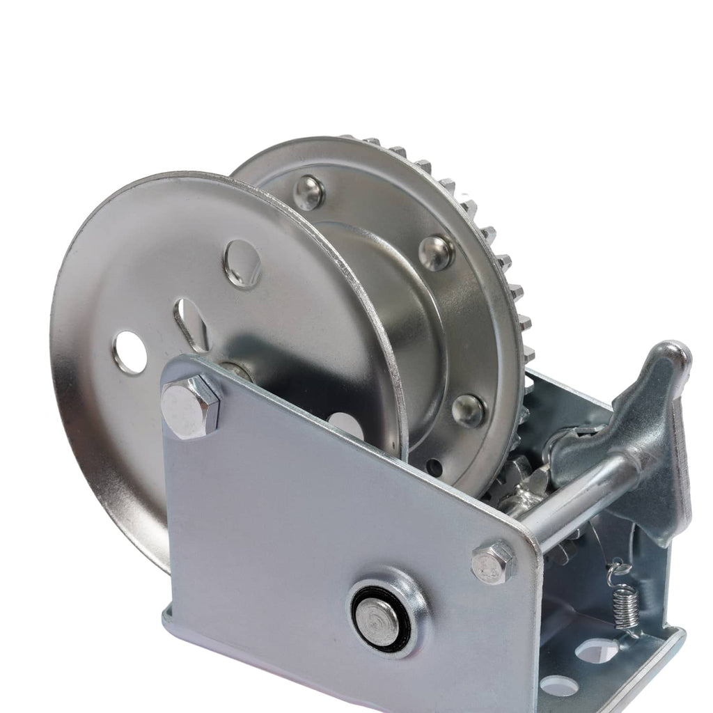 Winch assembly close-up with ratchet drum, steel side plate, and crank linkage