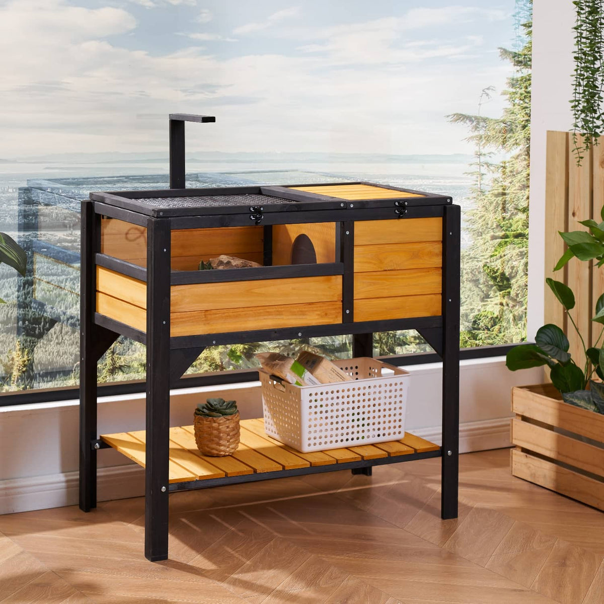 Wooden reptile habitat with black frame, mesh top cover, and front opening compartment