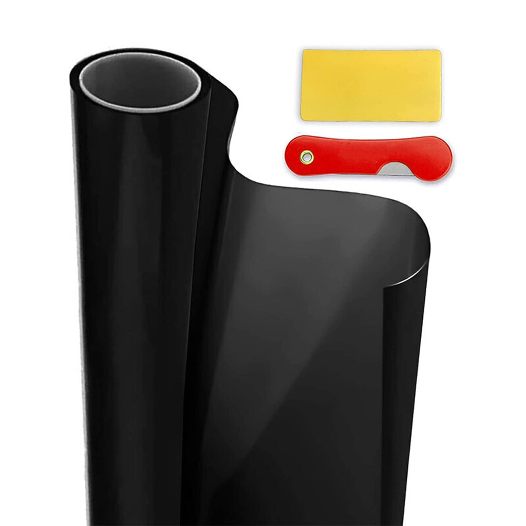 Roll of black window tint film with yellow applicator squeegee and tools