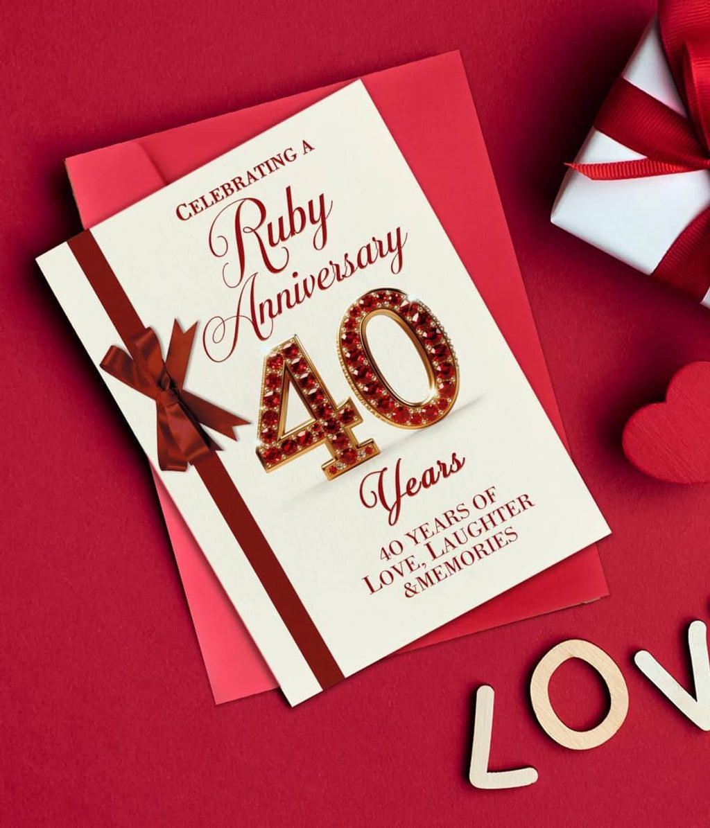 Ruby wedding anniversary card with red ribbon bow, 40, and LOVE-themed decor nearby