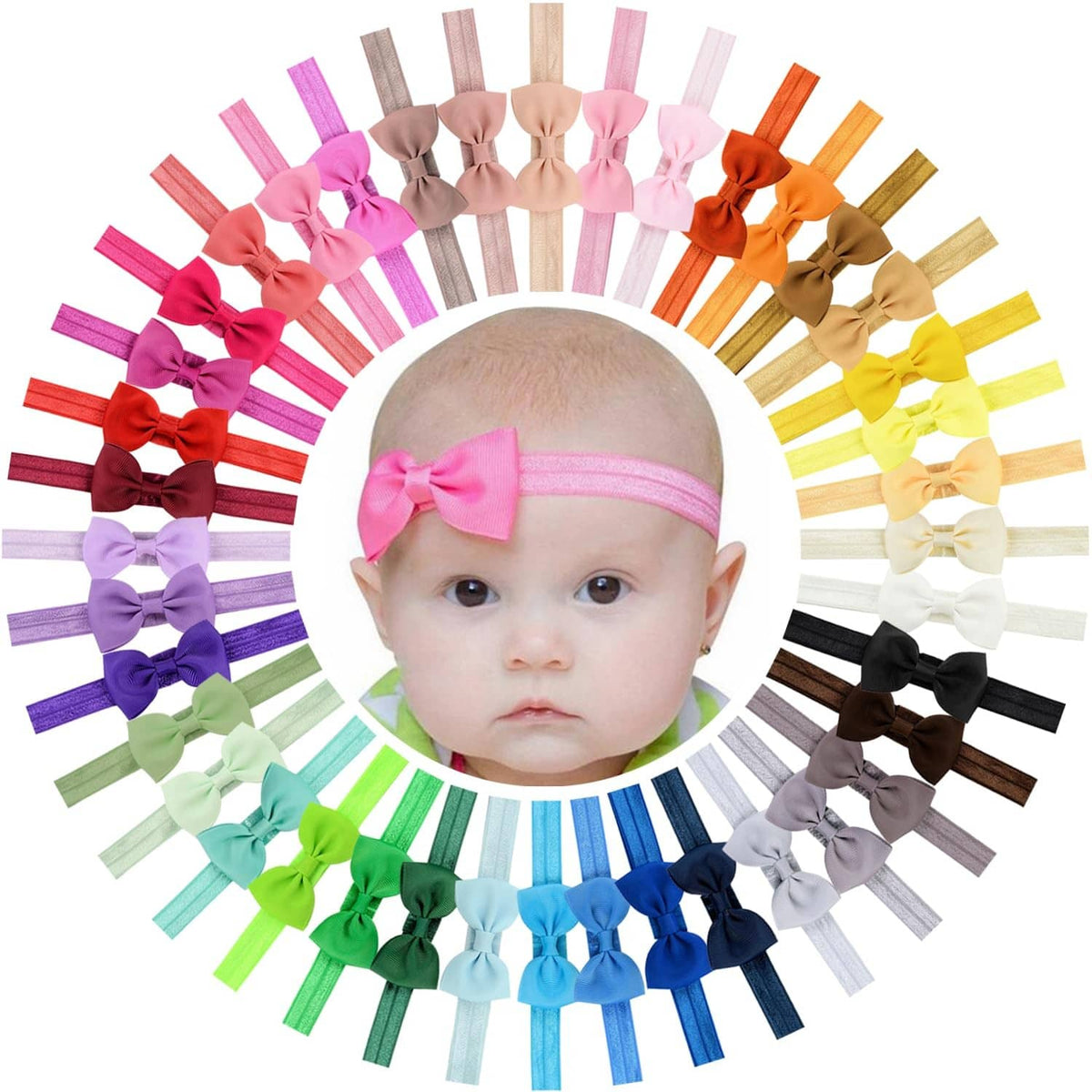 Wide array of baby headbands with multicolor bows on a model