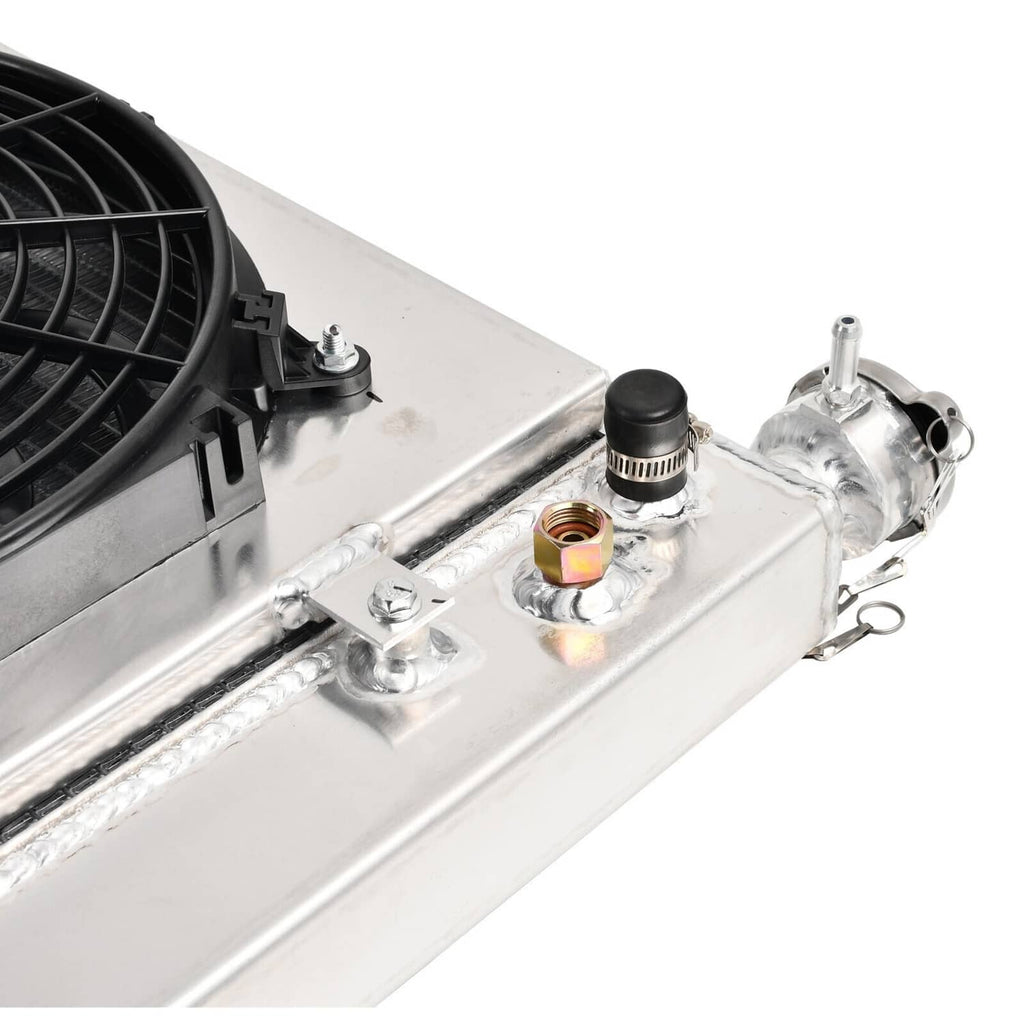 Radiator fan relay components on silver radiator shroud, including sockets and brackets