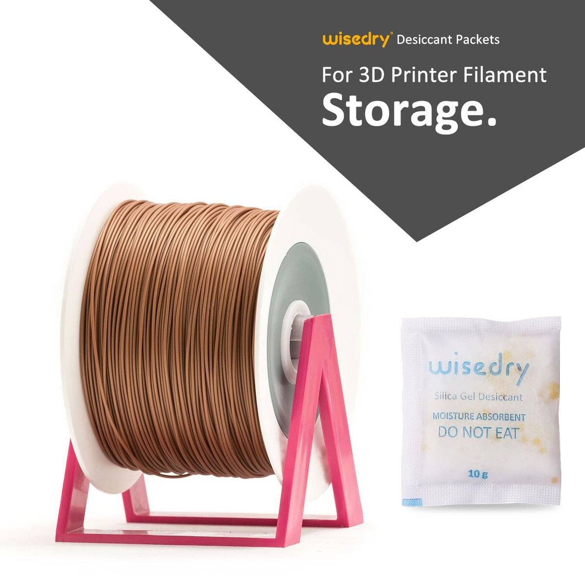 Wisedry silica gel desiccant sachet next to brown 3D printer filament spool