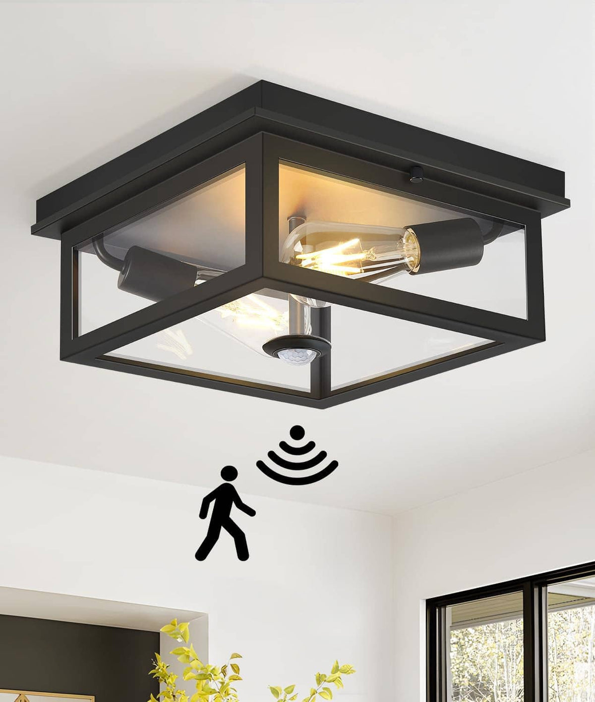 Black flush mount outdoor ceiling light with clear glass cover and motion sensor