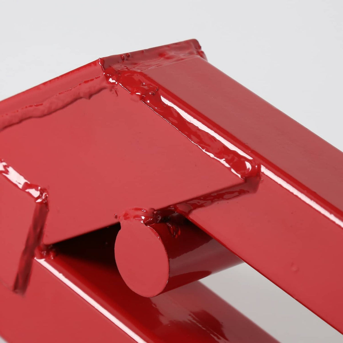 Red ball mount receiver clamp close-up of lever, painted metal cup, and mounting opening