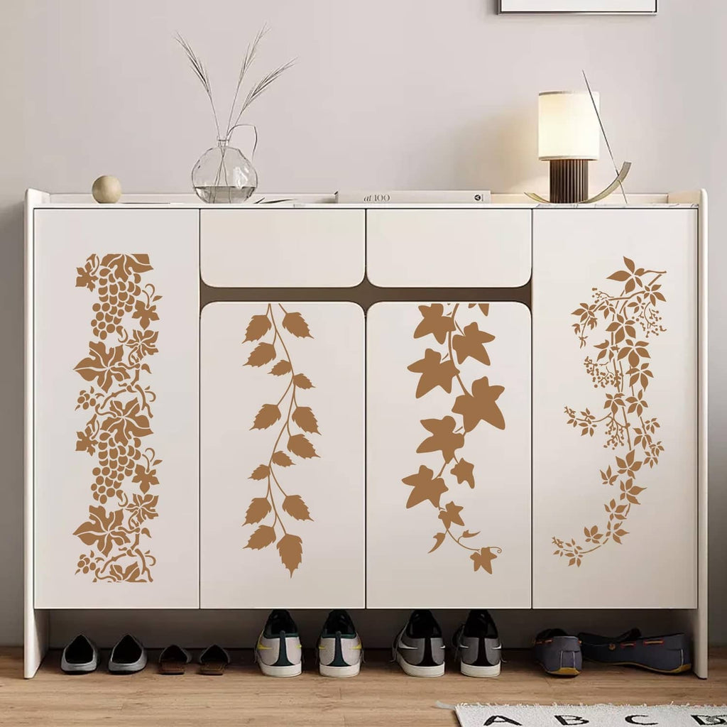 Leaf vine stencil sheets with brown floral patterns on cabinet doors and panels