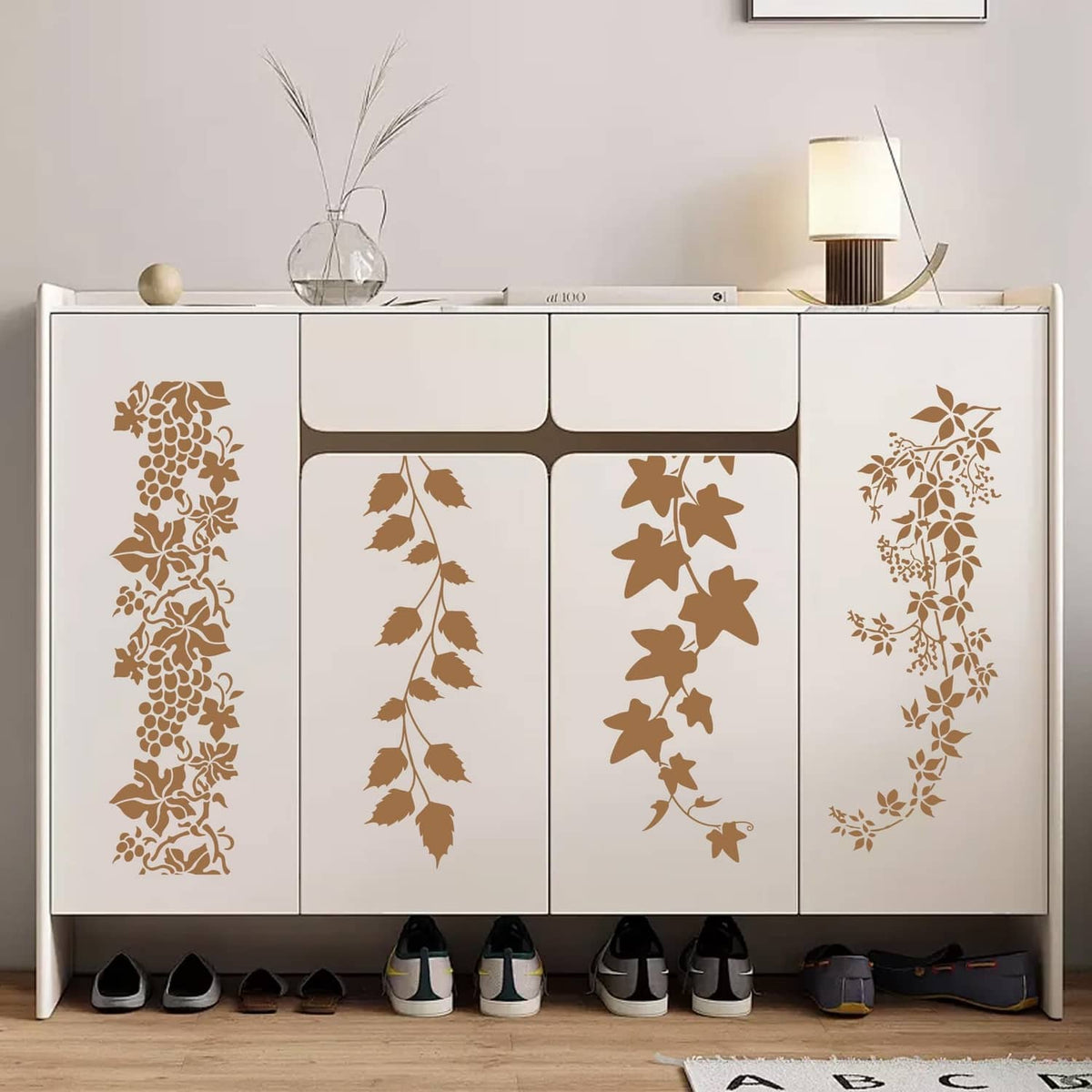 Leaf vine stencil sheets with brown floral patterns on cabinet doors and panels