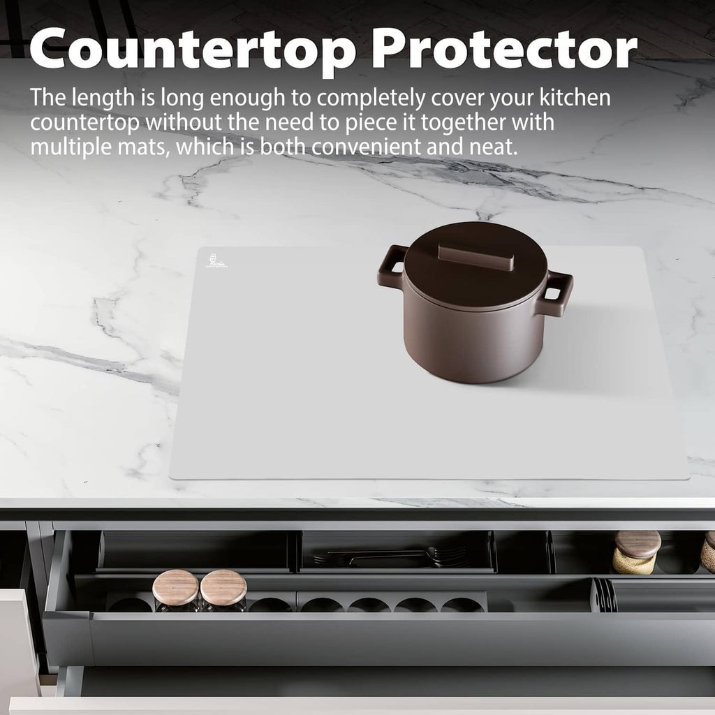 Gray silicone countertop protector mat covering a countertop with cookware