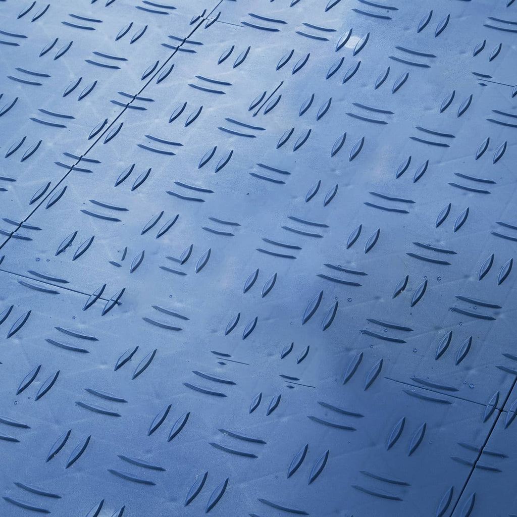 Blue garage floor tile close-up with raised anti-slip dash texture pattern