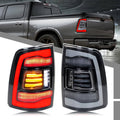 Pair LED tail lights with red and clear lenses, black housing, visible amber and red LED bars
