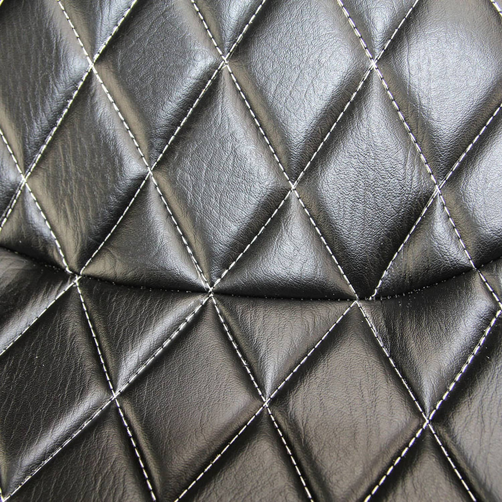 Close-up of black diamond-quilt seat leather with stitched seam lines