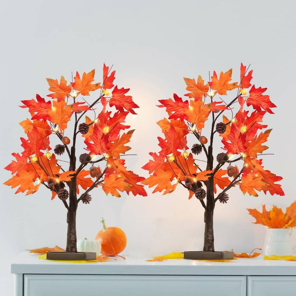 Two tall fall maple leaf light-up tree decorations with warm glow LEDs