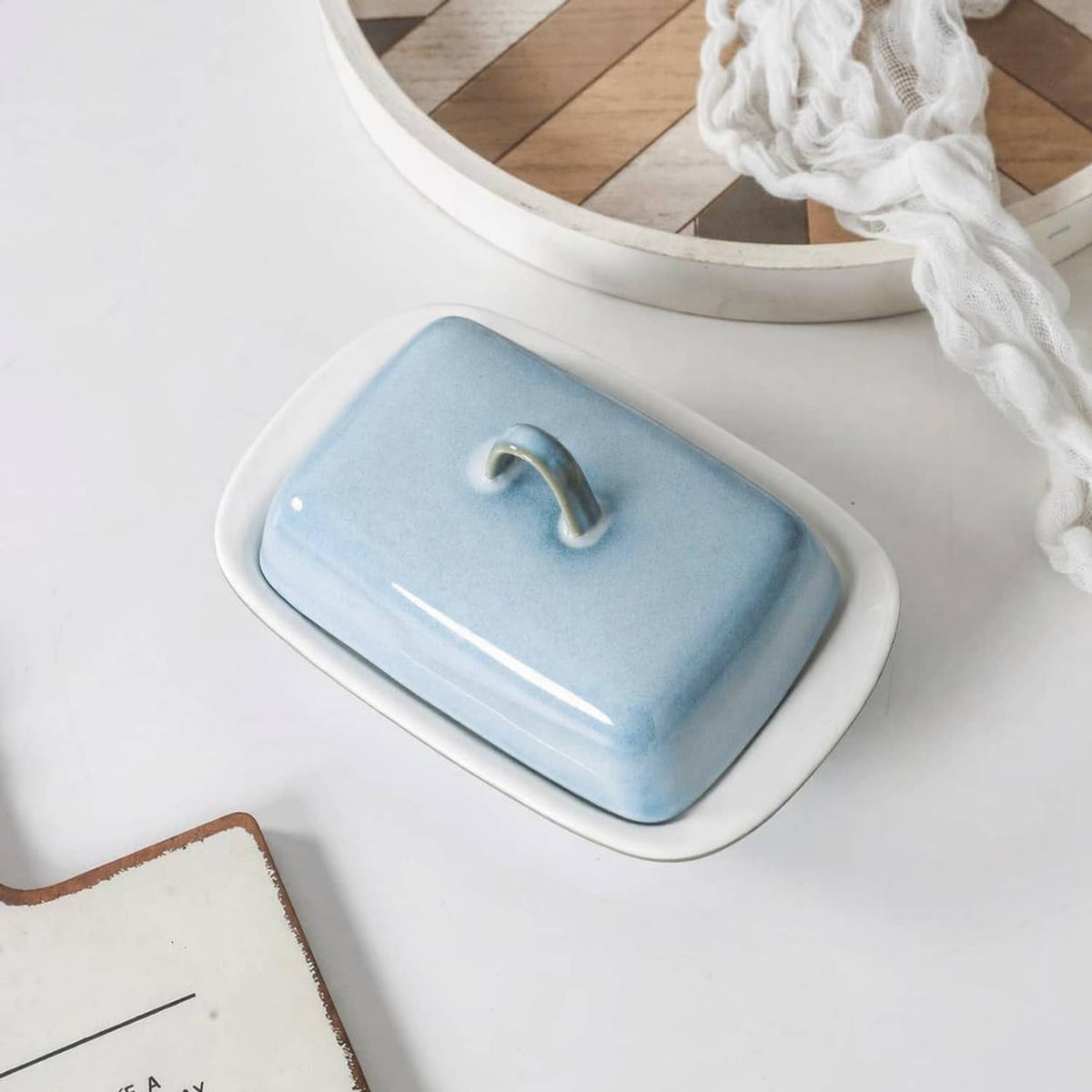 Blue ceramic butter dish with lid removed; rectangular tray with built-in handle