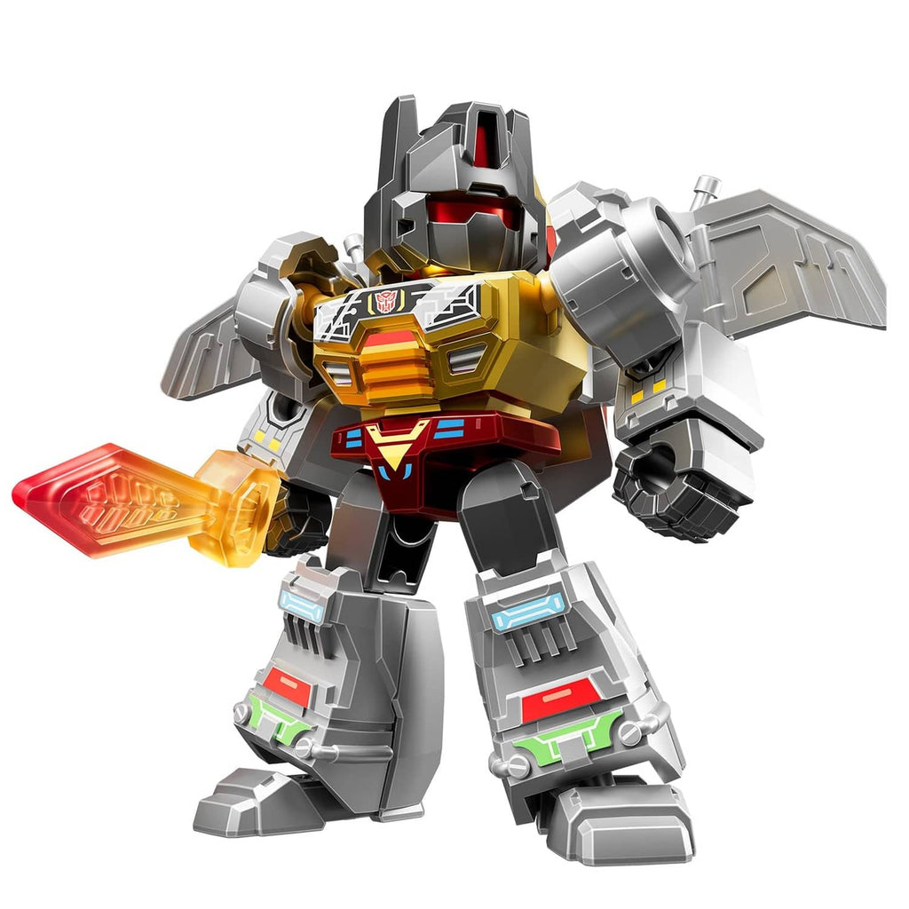 Gold and gray Transformers defender robot figure with red accents, posed