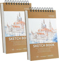 Small sketch book set with brown hard covers, top spiral binding, and illustrated city covers.