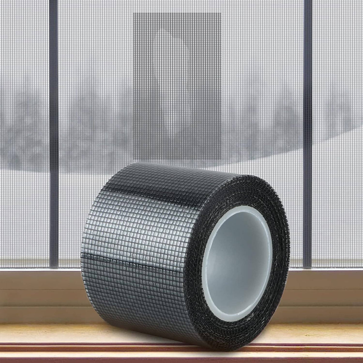 Window screen repair tape roll with dark mesh and white adhesive backing.