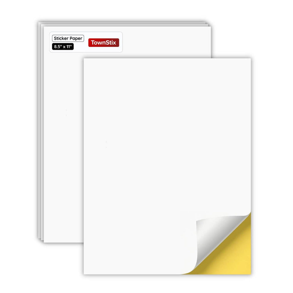 Printable white sticker paper sheets with light backing, stacked and ready to use