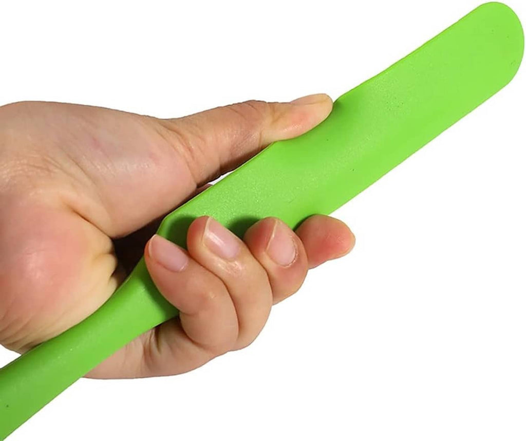 Green silicone spatula held by hand, flexible flat blade