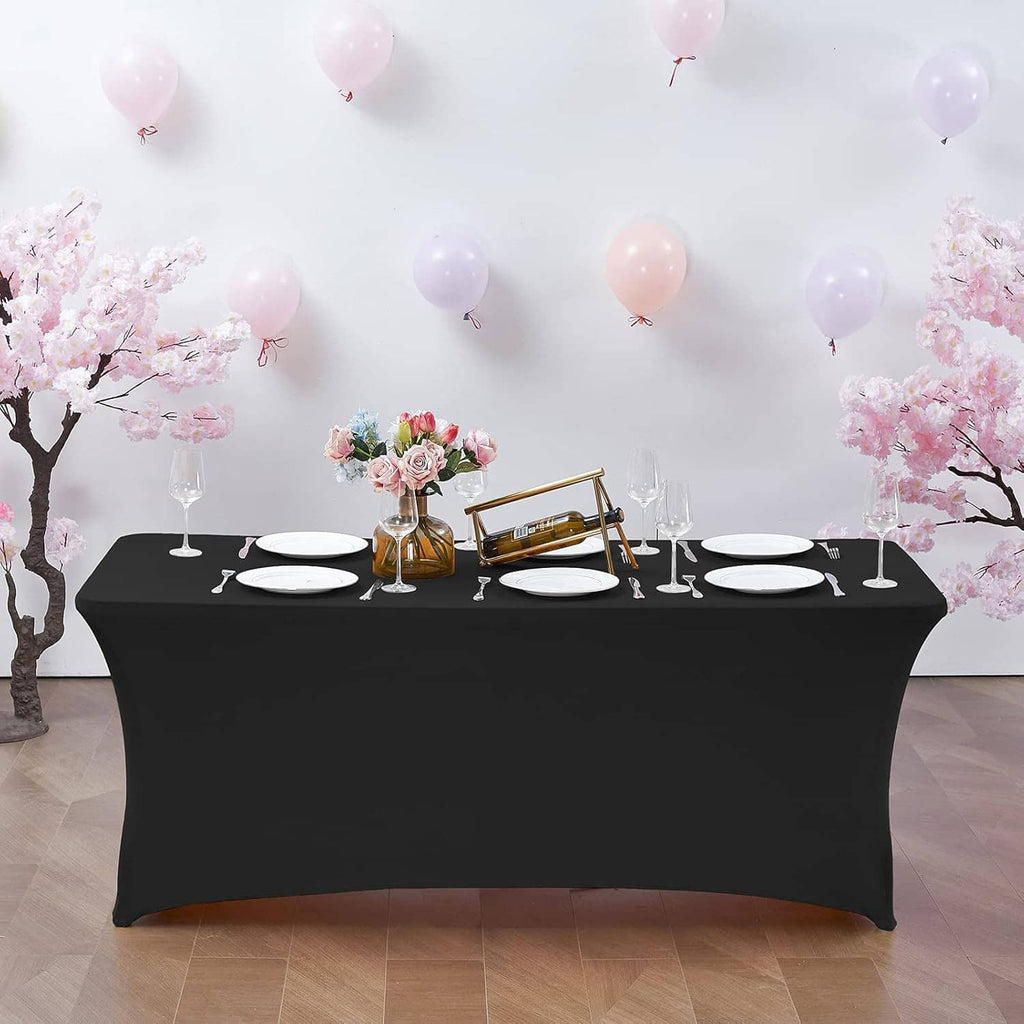 Black rectangular stretch table cover with elastic fit for 6 ft tables.