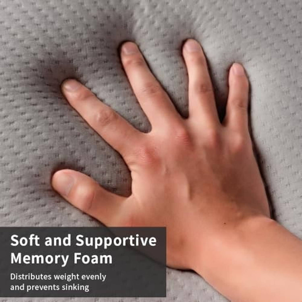 Grey textured memory foam topper surface with hand pressed into the cushion