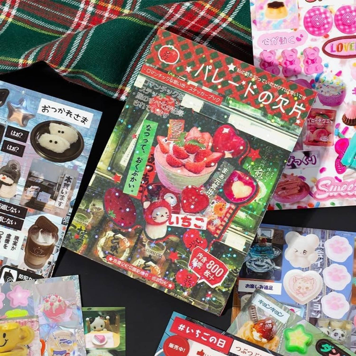 Sticker book pages with strawberry and bear-themed sticker packs arranged together