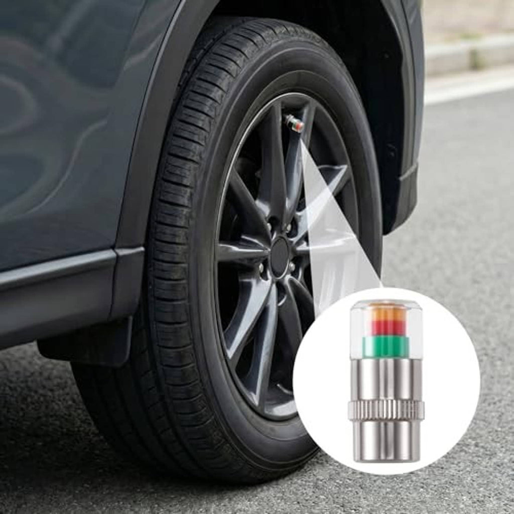 Tire valve cap installed on a black car wheel rim, silver metal with colored bands