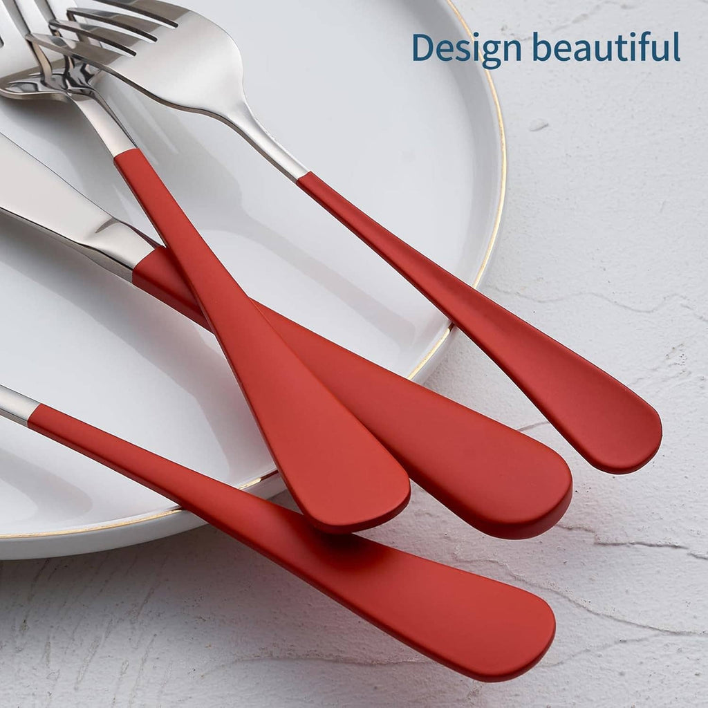 Close-up of red-handled stainless flatware with mirror finish forks and spoons