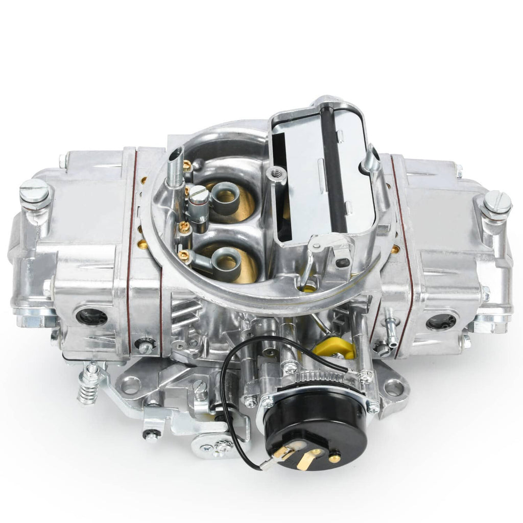 4-barrel carburetor showing venturi openings and black e-choke module