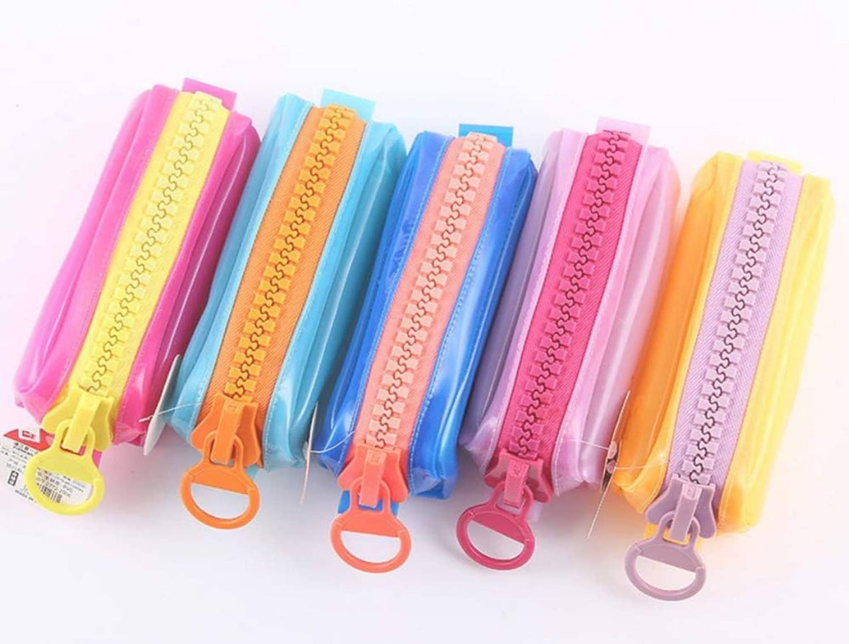 Assorted colorful plastic zipper tapes with large pull tabs and chunky teeth.