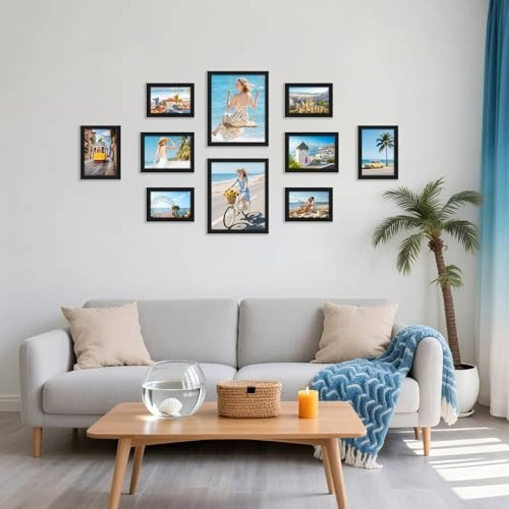 Black multi-picture frame collage set with small photo prints on wall