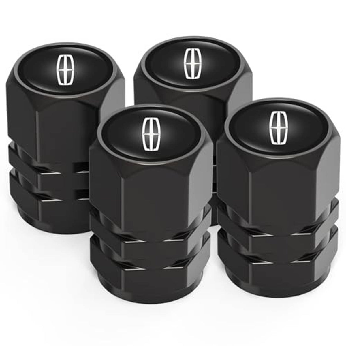 Set of four black tire valve stem caps with oval tire symbol and faceted grip