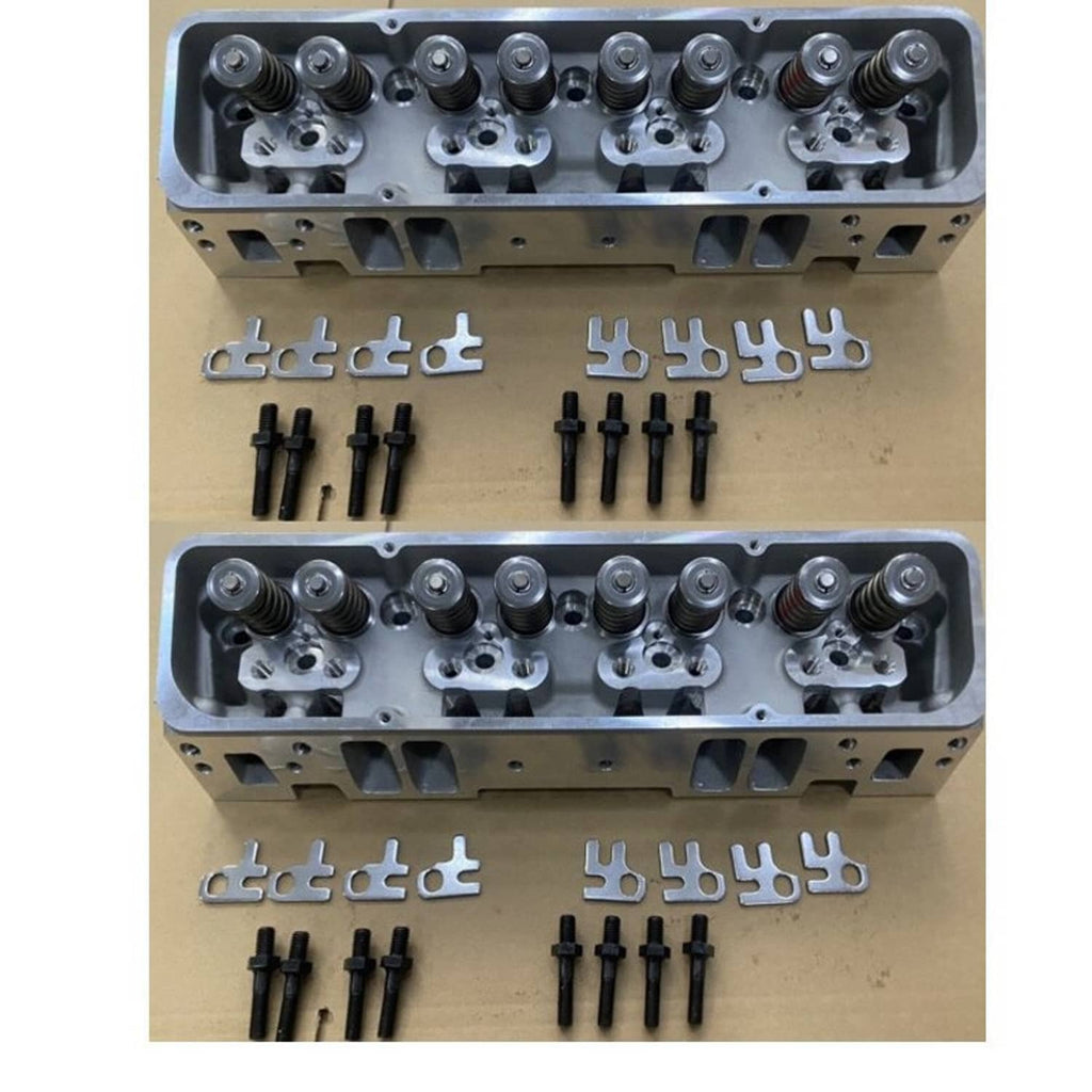 Aluminum cylinder head with hardware kit laid out, silver head and black fasteners