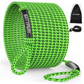 Green and black woven boat tow rope, coiled bundle with attached loop handle