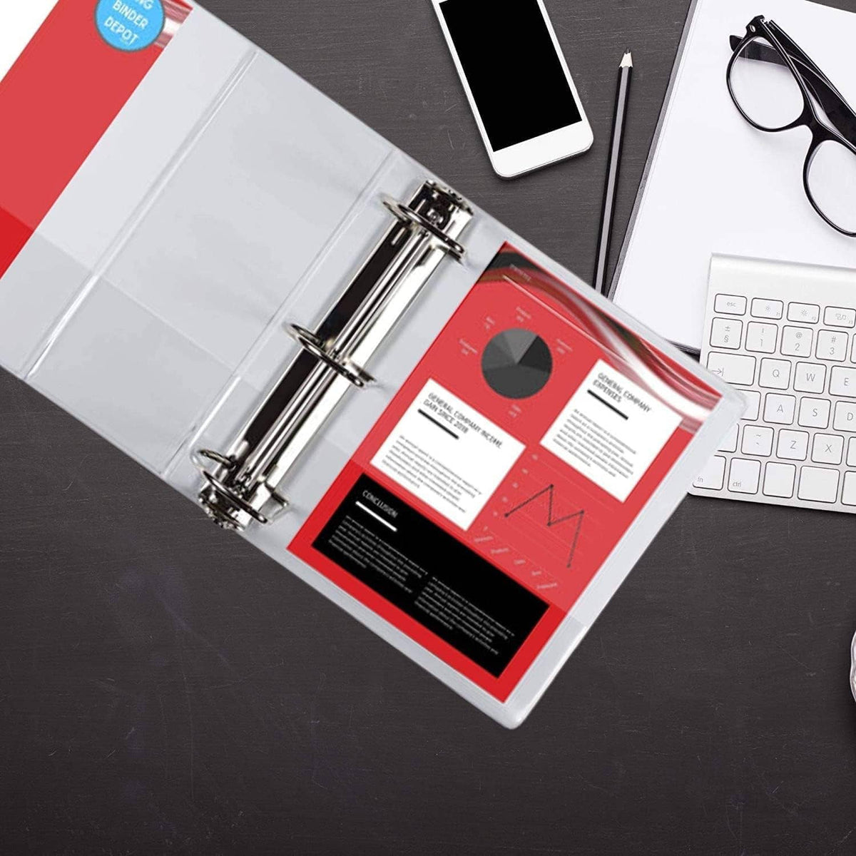 3-ring binder with metal rings and red document insert on a desk with stationery