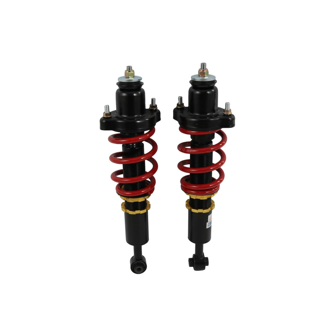Coilover struts with black bodies, red springs, and gold-and-black lower adjustment collars