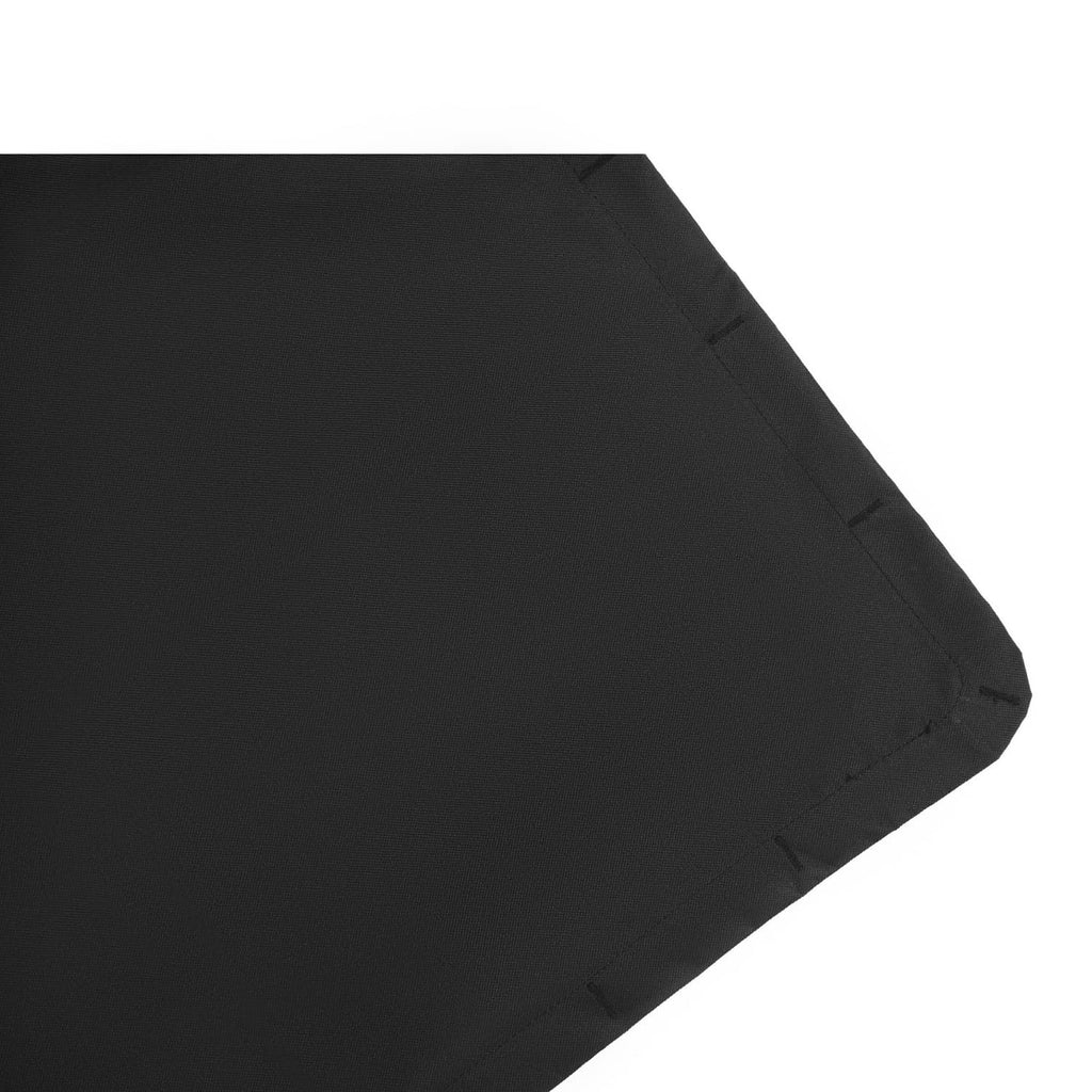 Black canopy fabric corner with reinforced stitching and protective edge trim.