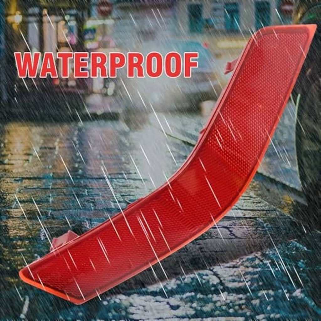Single red rear bumper reflector with textured lens and mounting tabs, curved design
